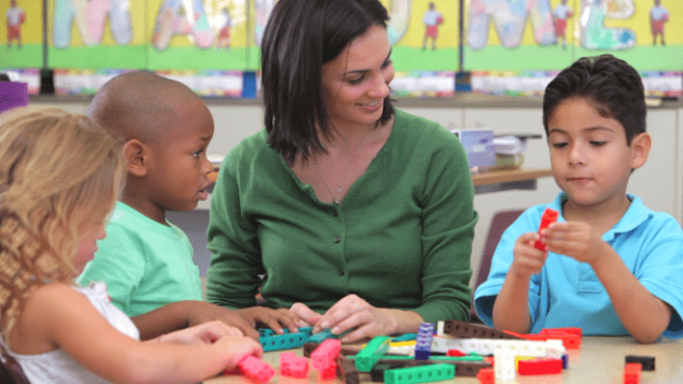 woman working with kids does q and a with verbal beginnings