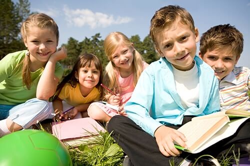 5 kids reading building social skills in social beginnings program