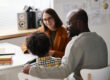 Father talking to teacher in classroom