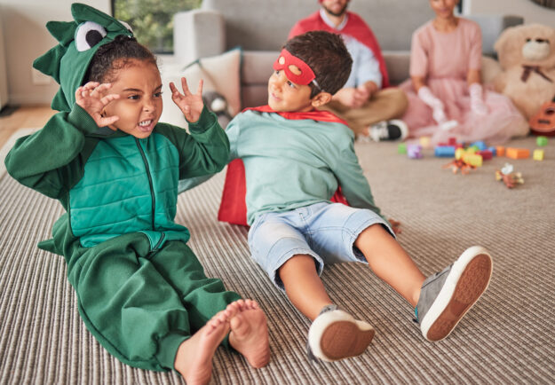 verbal beginnings children playing in halloween costumes dragon and super hero 2026 533894532