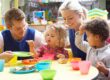 children and caregivers eating together 32668613