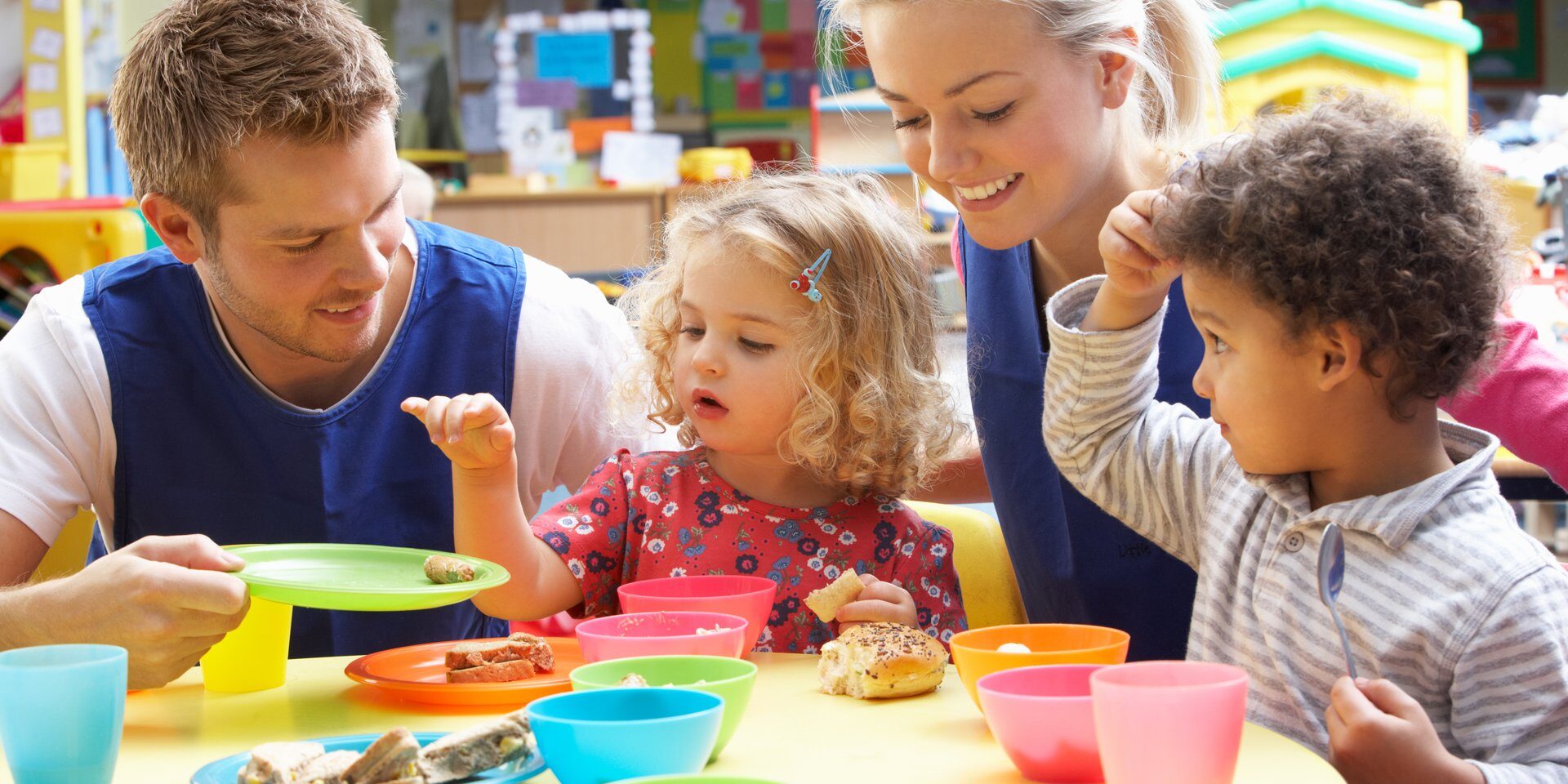 children and caregivers eating together 32668613